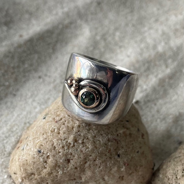 Stirling silver and rose gold bezel set green sapphire ring with rose gold ball design detail